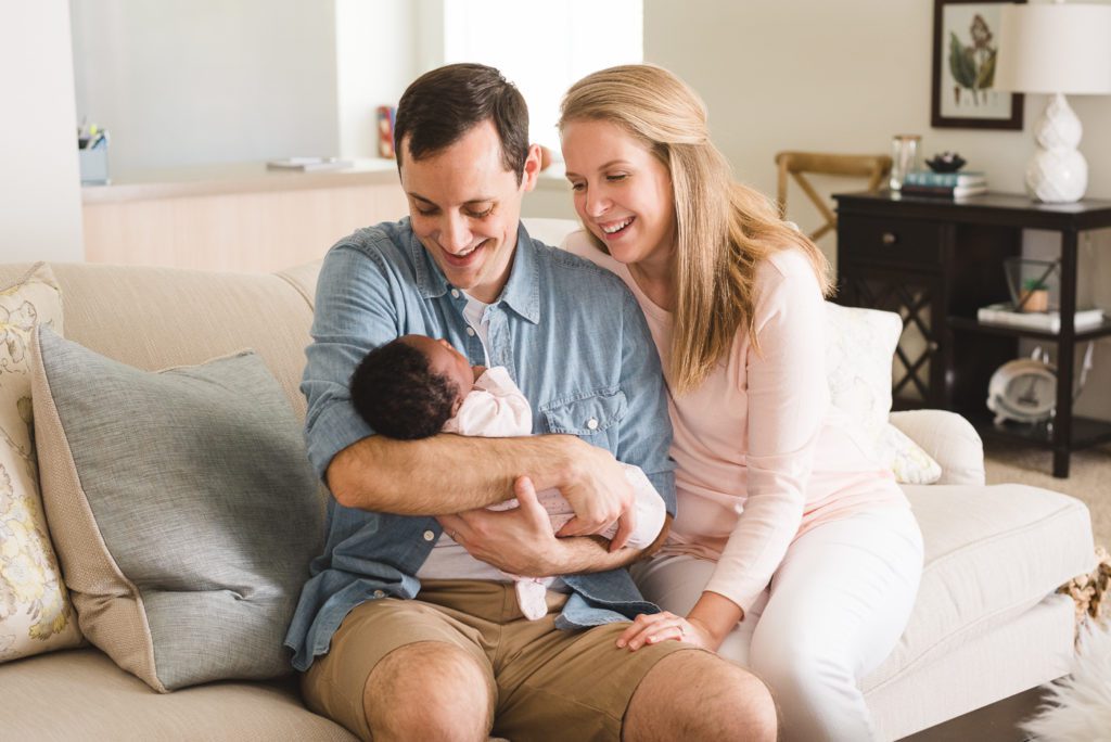 tampa lifestyle newborn session dad holding baby